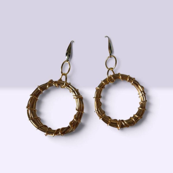 Gold toned circular twisted earrings