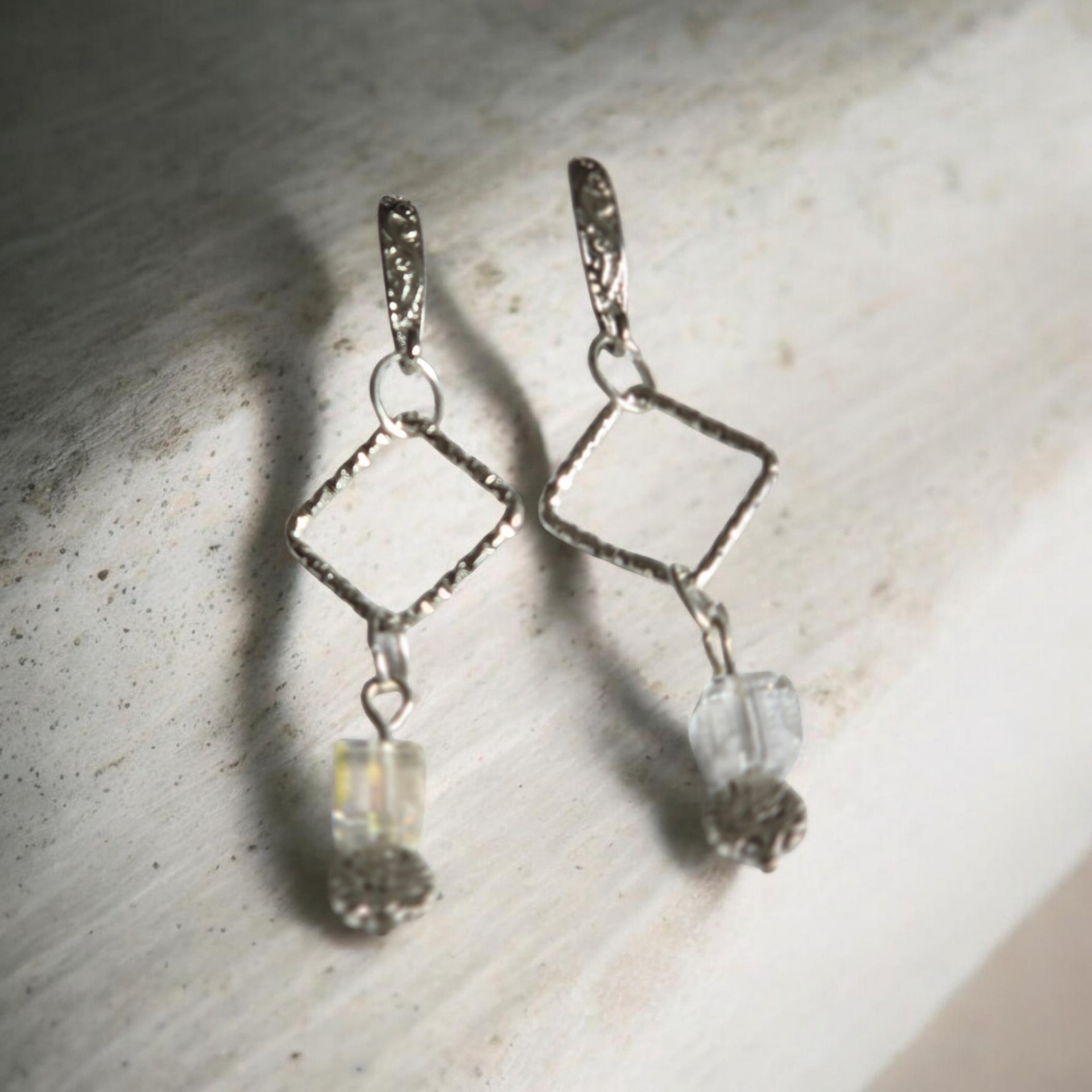 Delicate earrings with white crystal beads