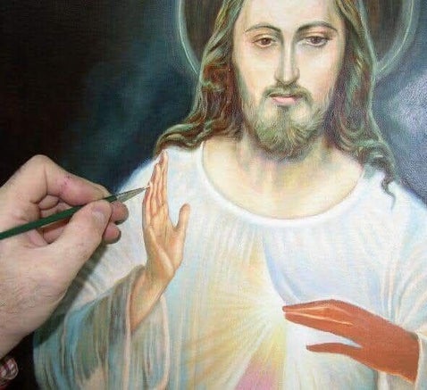 A painter with a brush painting the Divine Mercy image.