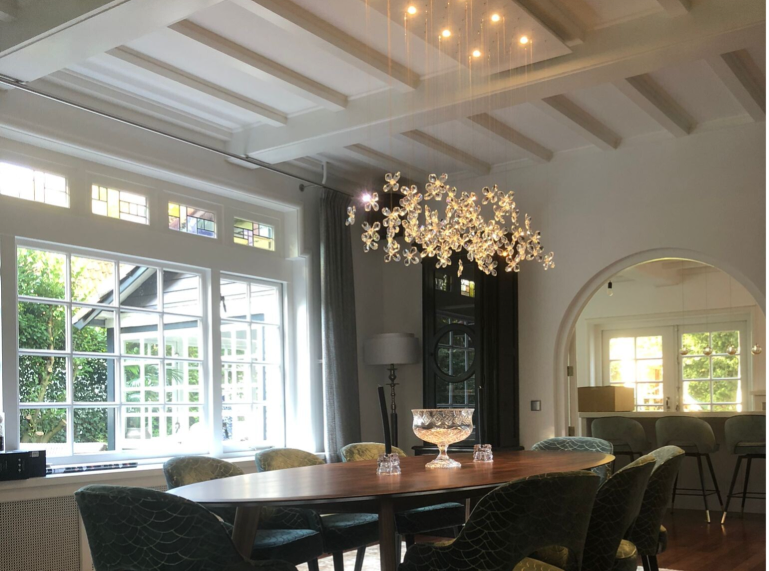 Floating Crystal chandeliers above dining table – handmade by Groenensteyn Light Netherlands.