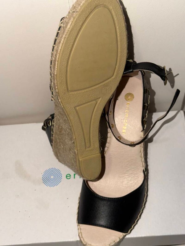 leather Eric Michael Val espadrille sandals feature gold stud details on the ankle strap and a woven rope heel.
