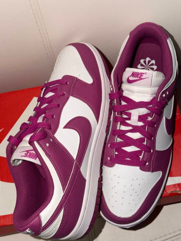 Nike Dunk Low Next Nature sneakers in the "Hot Fuchsia" colorway, featuring a vibrant purple-pink and white leather upper.