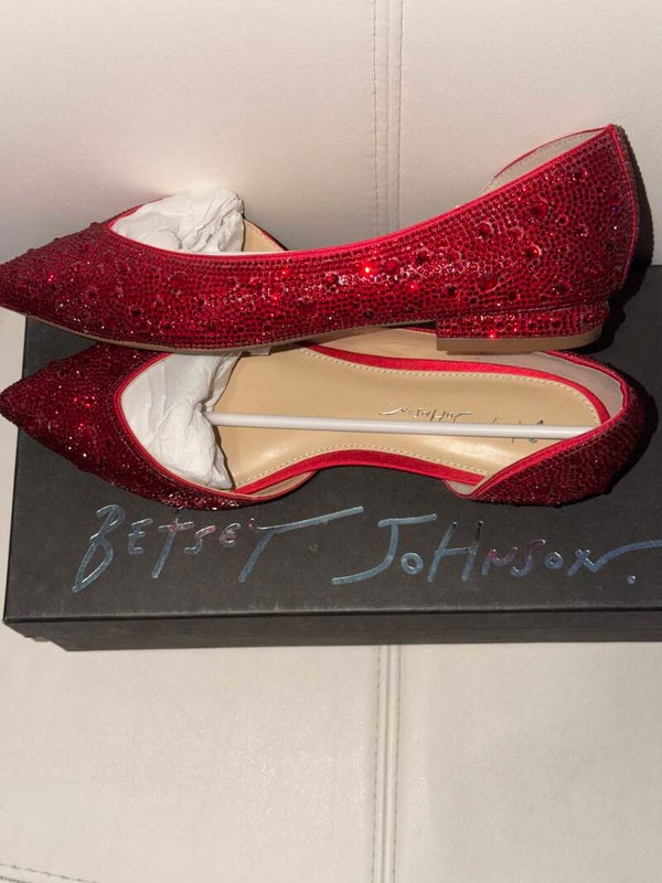 Betsey Johnson Remy red glitter embellished flats feature a pointed toe and