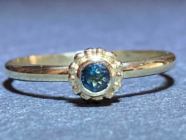 Gouden ring met London blue Topaas