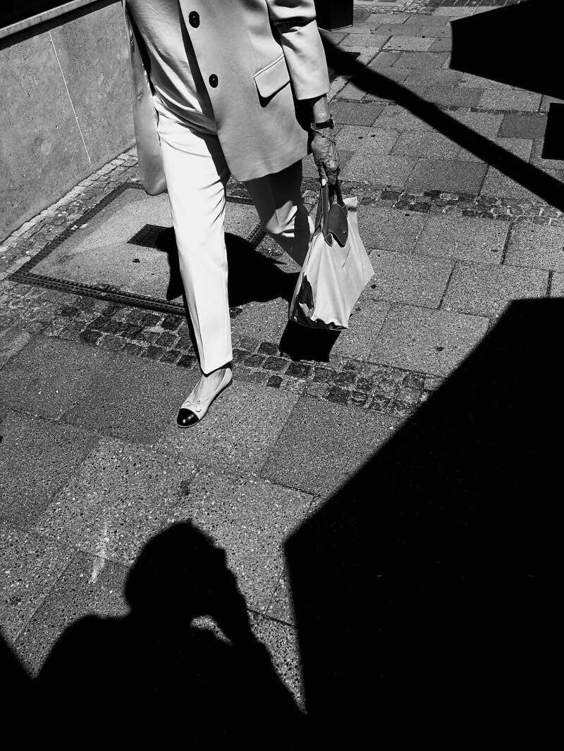Elegance in Passing – Light, Shadows and a Munich Lady BW