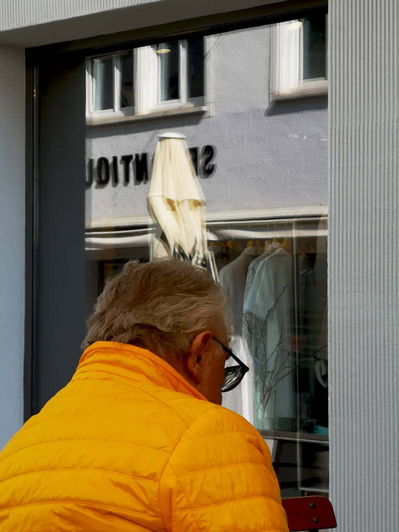 "Man with a yellow jacket."