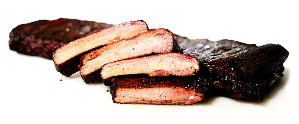 Caption: Nothing says BBQ like a rack of ribs kissed by wood smoke.