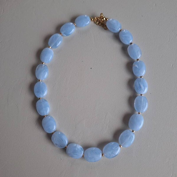 Lichtblauwe ovale kralen ketting