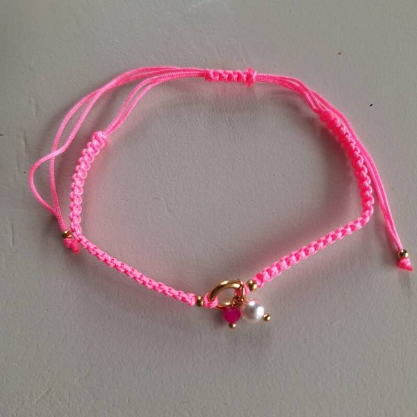 Roze gevlochten enkelbandje