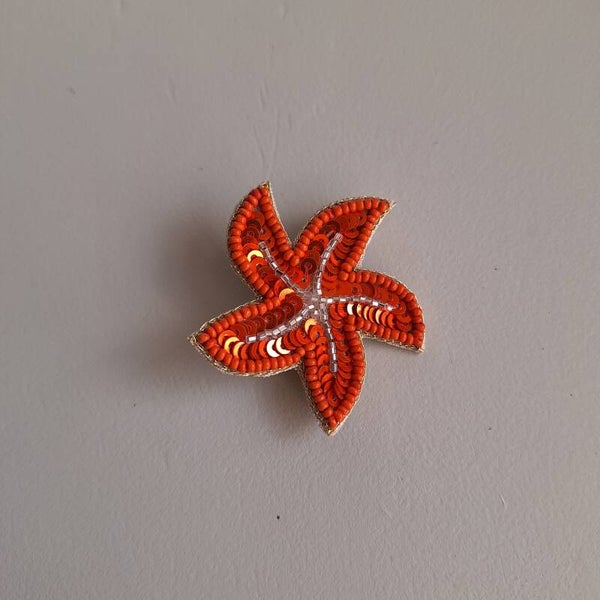 Broche oranje zeester