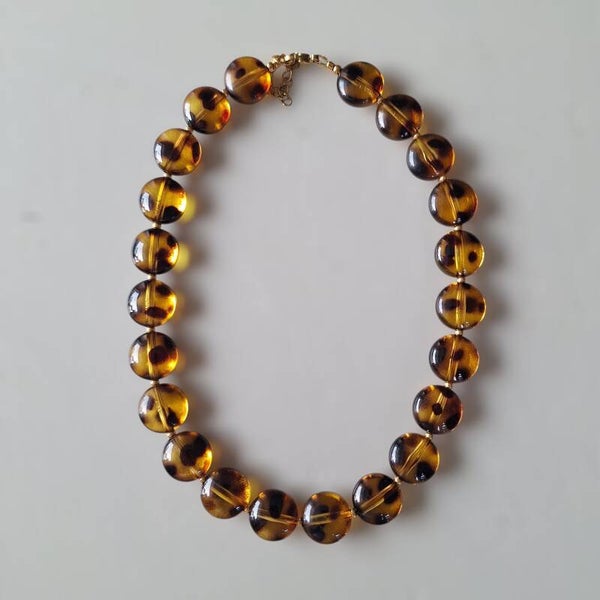 Bruine rondelle luipaard ketting
