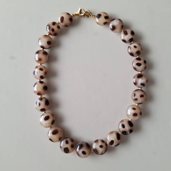 Beige rondelle luipaard ketting