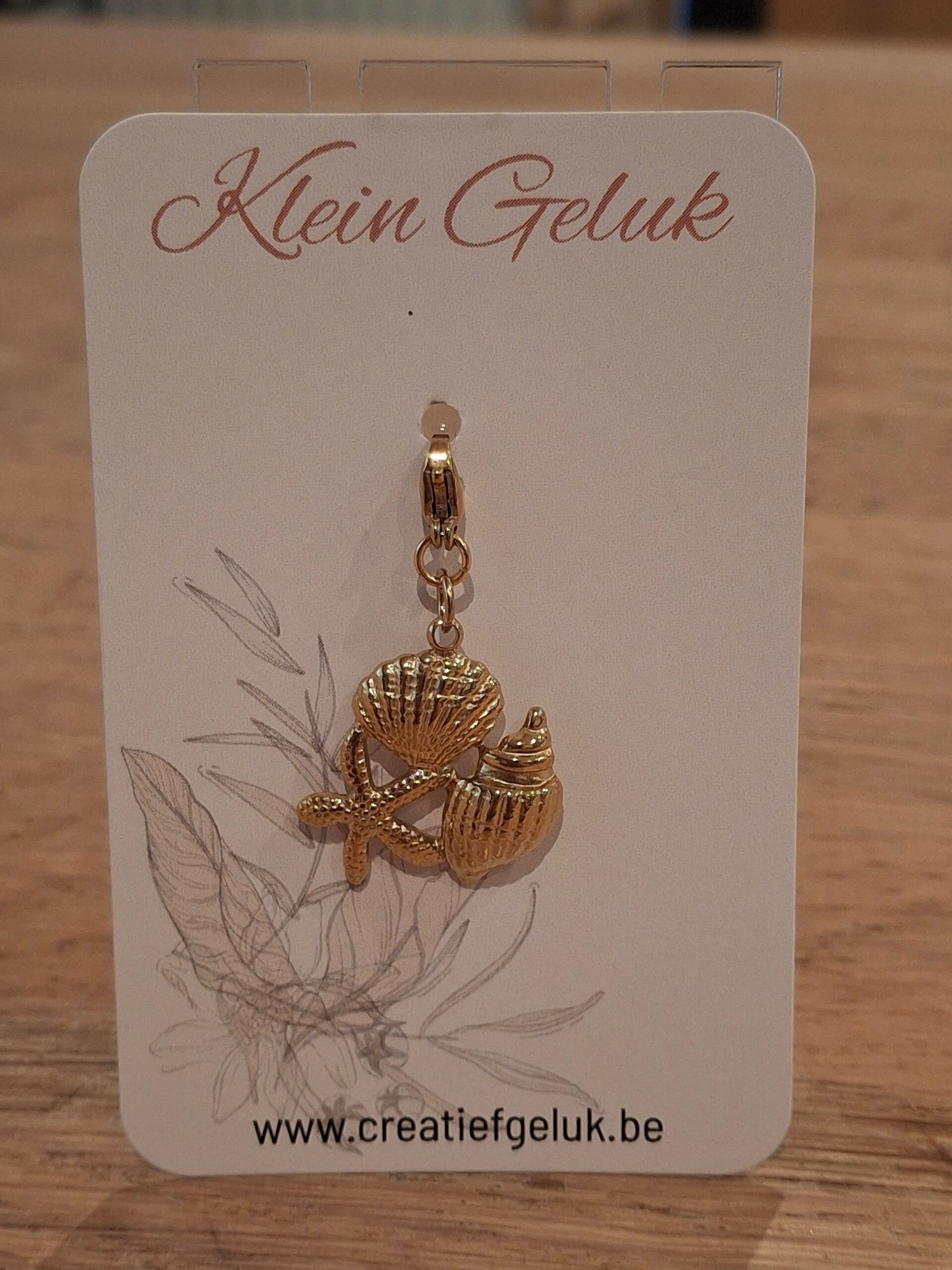 Schelpen bedel: stainless steel gold-plated