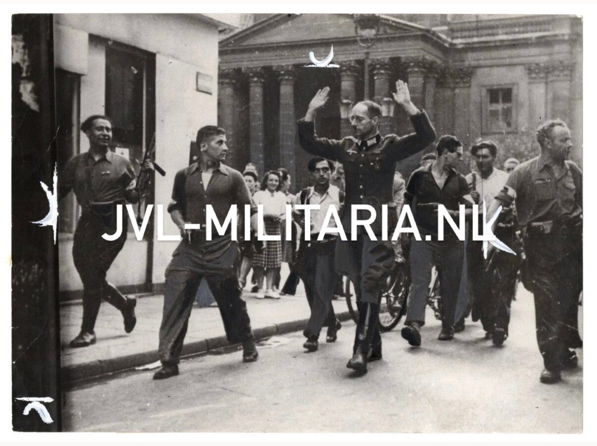 French press photo: The liberation of Paris German officer captured by the French resistance 1944