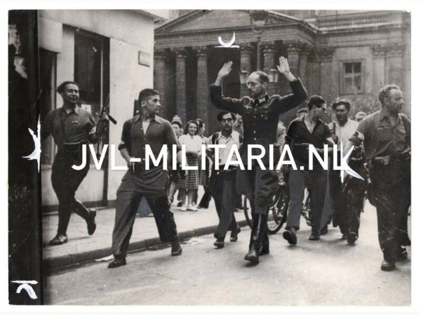 French press photo: The liberation of Paris German officer captured by the French resistance 1944