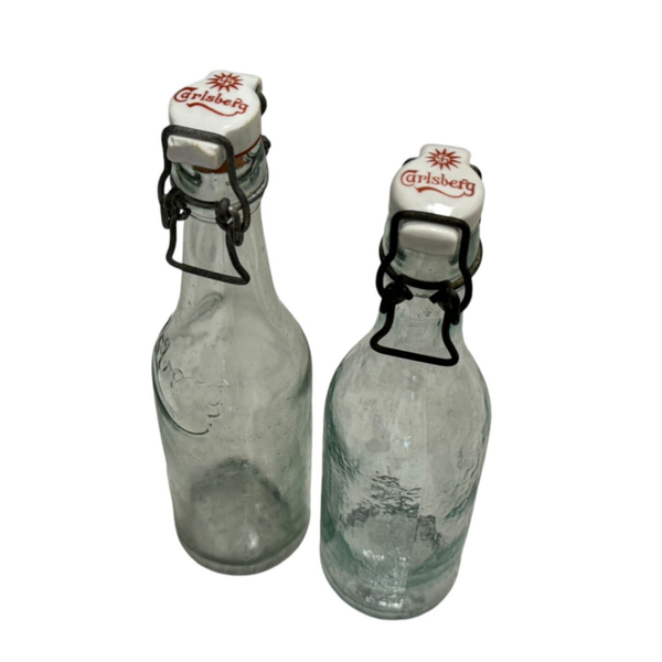Two Carlsberg beer bottles
