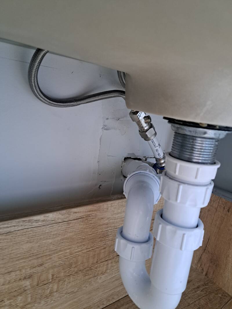 New waste pipe, wall sealed and vanity unit rehung