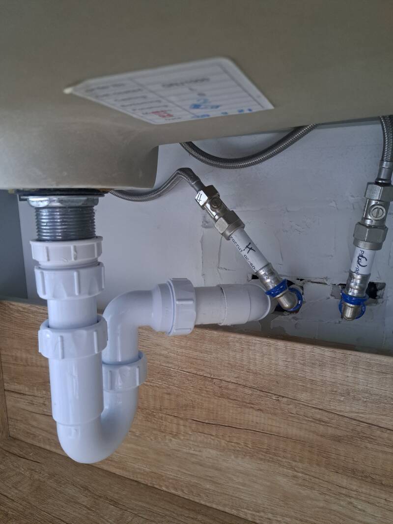 New Pt-trap fitted to waste pipe repairs 