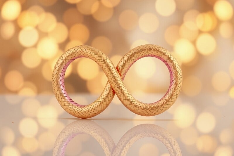 Infinity Glow – Goudroze Symbool Wanddecoratie