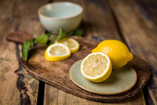 Lemons on a Rustic Wooden Board