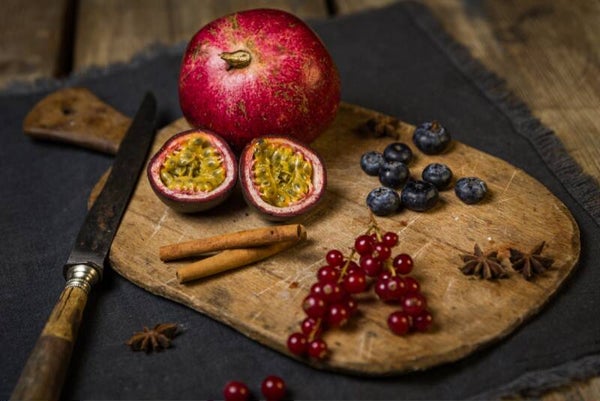 Rustic Still Life with Pomegranate, Passion Fruit & Berries