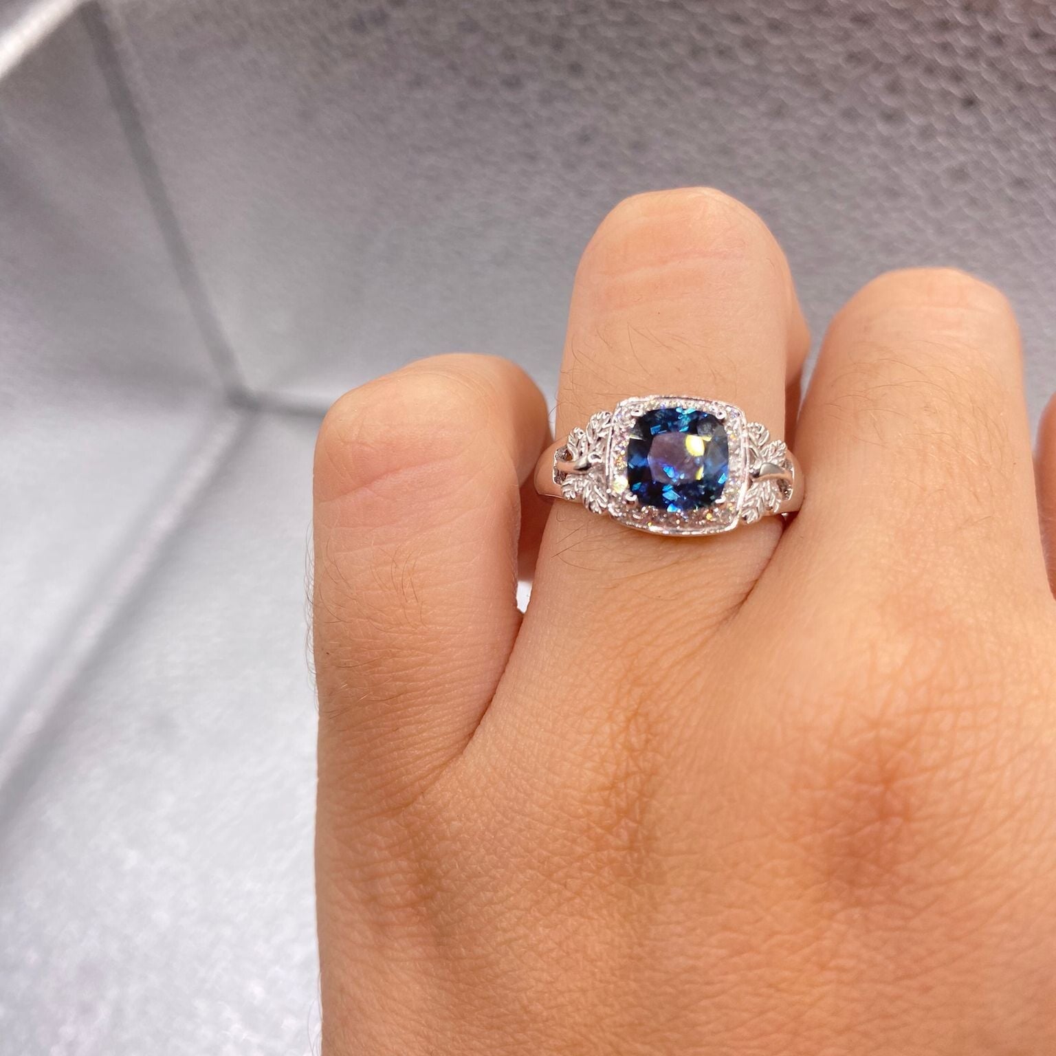 Blue Sapphire set in white gold with diamonds