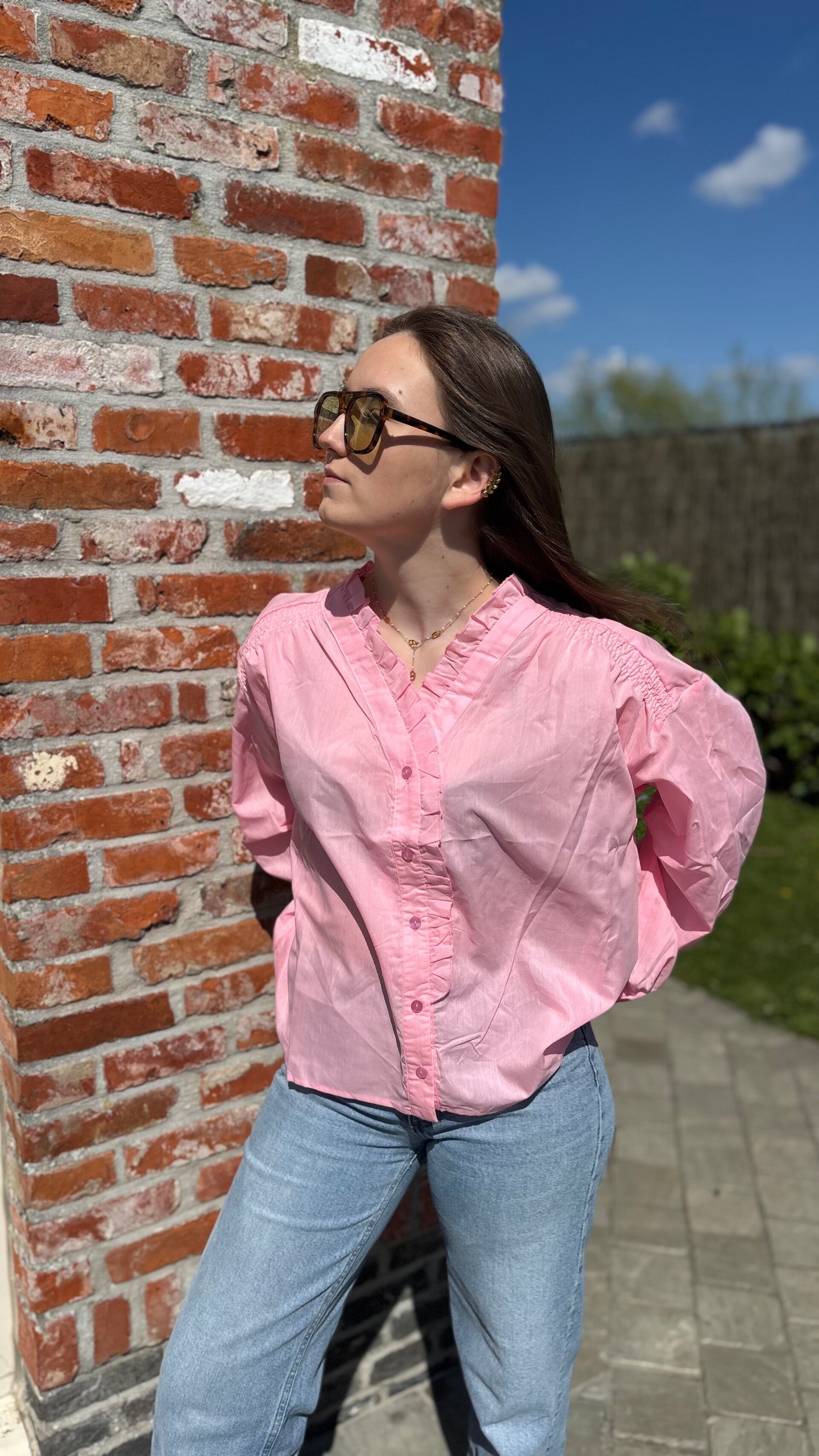 Pink blouse with ruffles