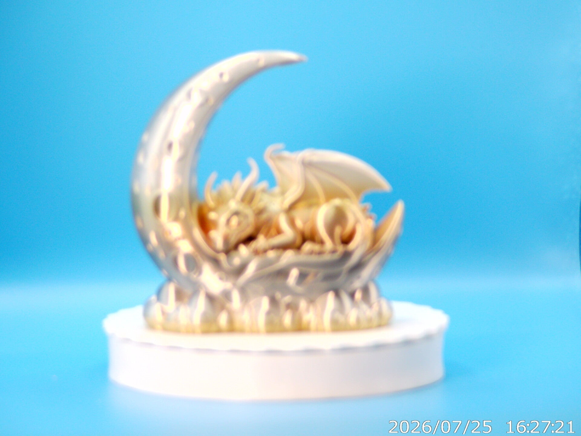 dragon asleep on a crescent moon
