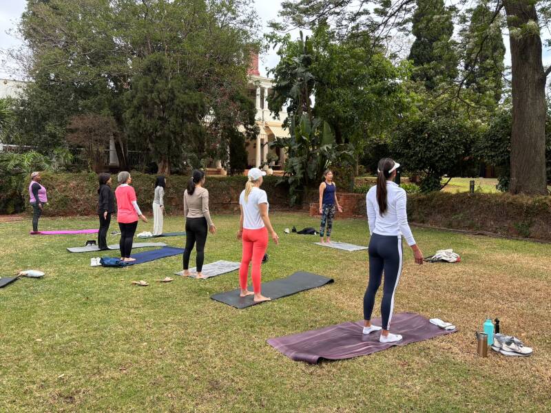 Group mat Pilates practice with Ning