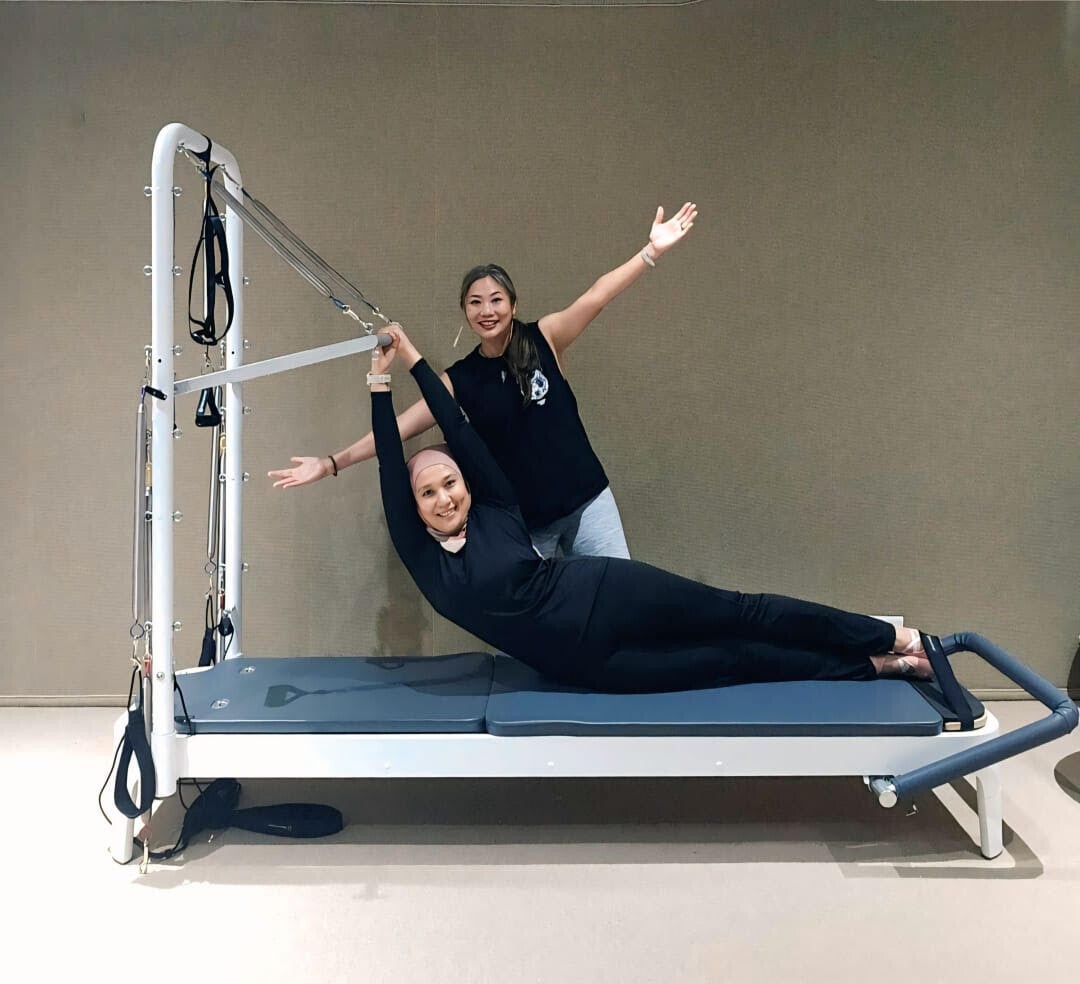 Pilates practice on the Pilates Tower