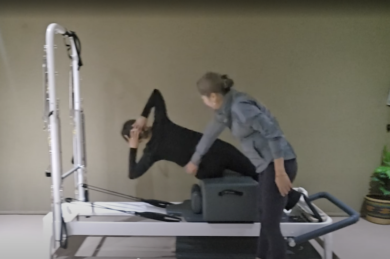 Reformer Pilates practice with Ning