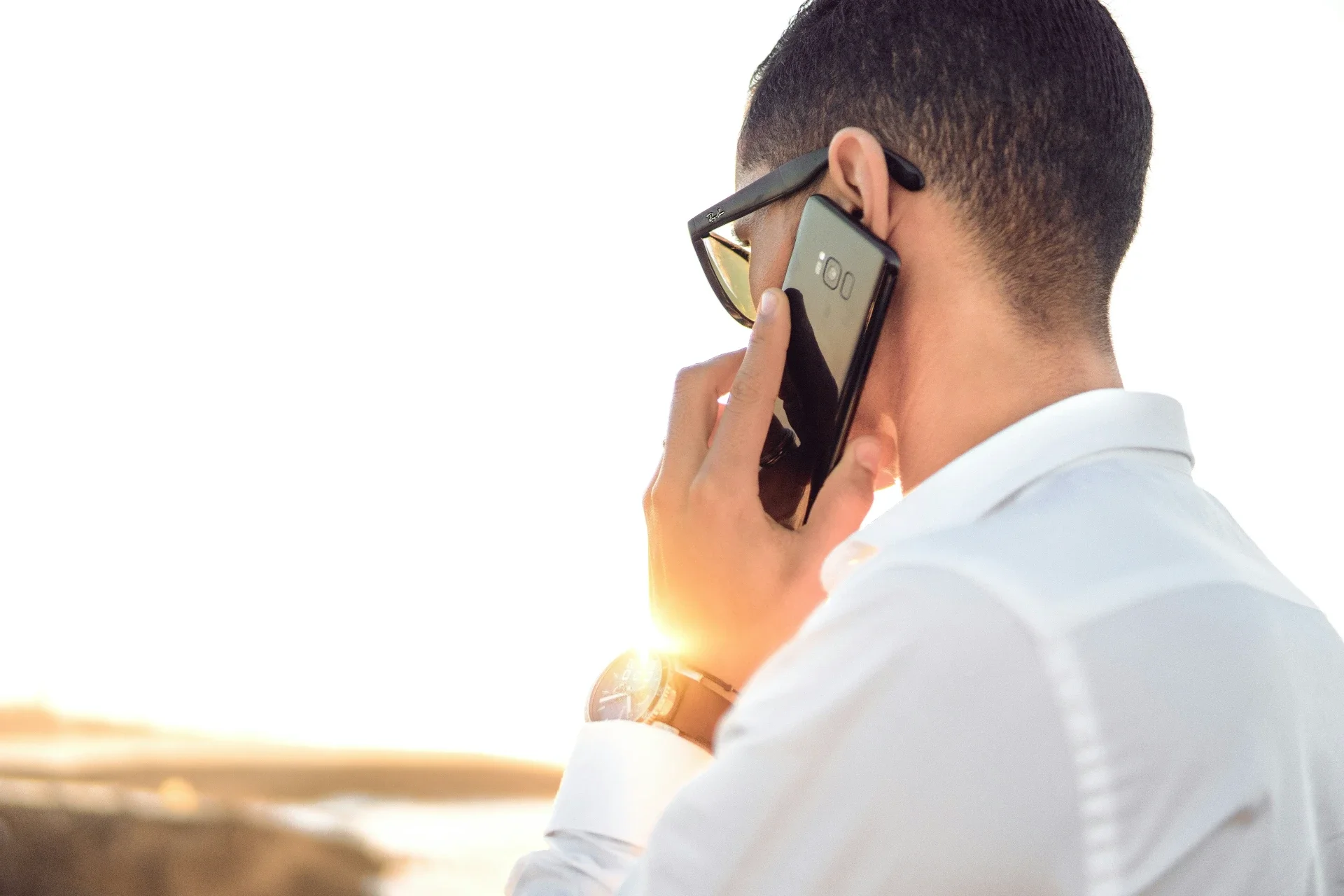 business person calling smartphone