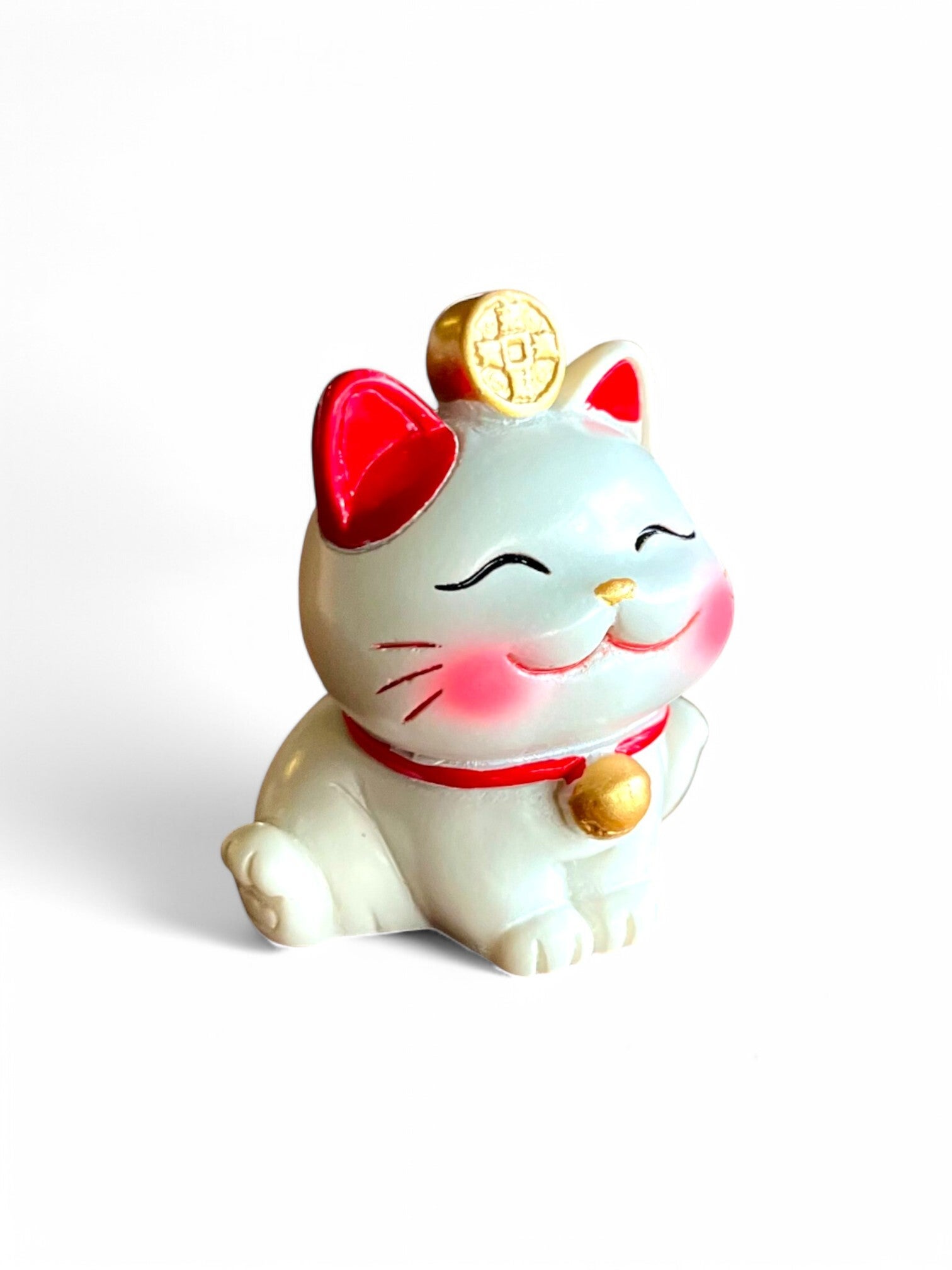 Lille hvid lykkebringende maneki-neko kat
