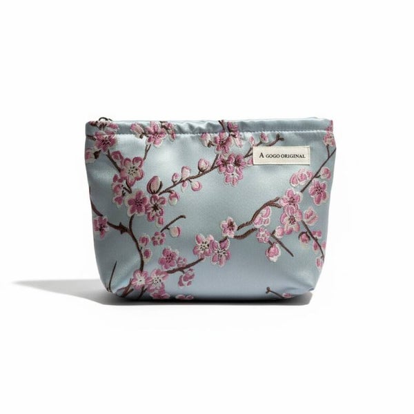 Turkis/lyseblå toilettaske med kirsebærblomster
