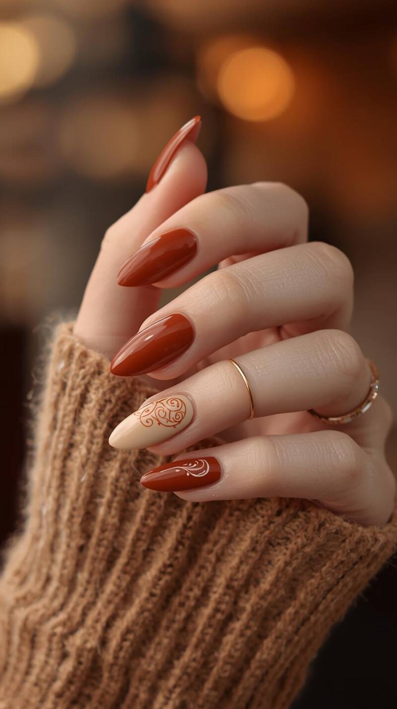 _a-realistic-female-hand-with-almond-shaped-nails-painted-in-warm-cinnamon-brown-and-creamy-beige-accent-nails-have-latte-inspired-swirl-art-the-hand-is-wearing-thin-standard.jpg