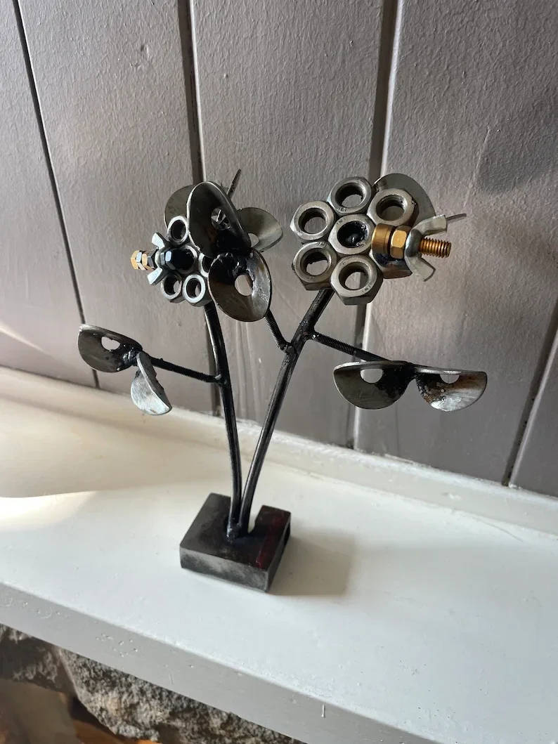 Pair of steel flowers with bees