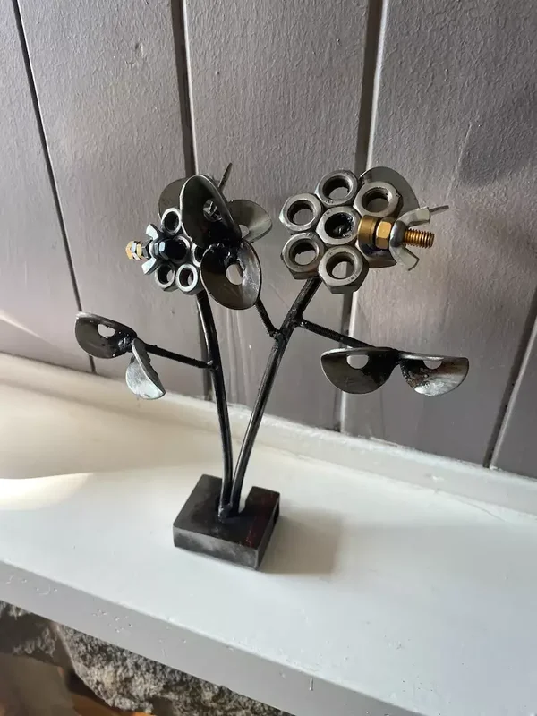 Pair of steel flowers with bees