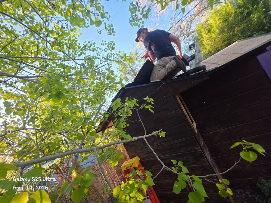 Shed roof repair in progress at a Bountiful property