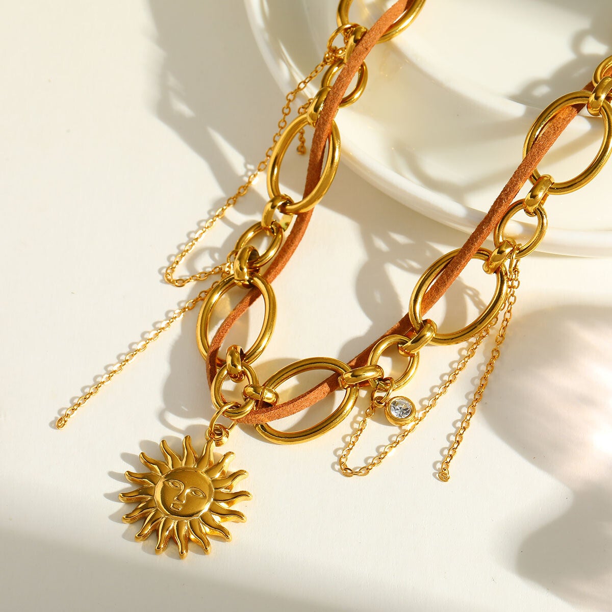 Edelstahlkette mit Sonnen Charm in gold
