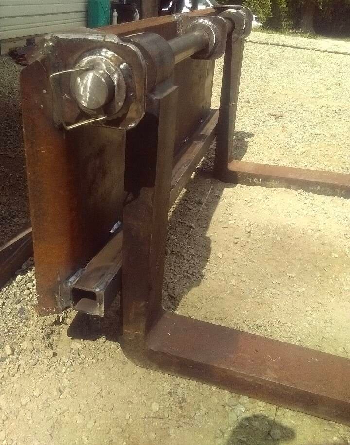 Custom skid steer quick attach pallet forks