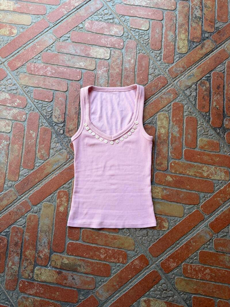 Top botones rosa