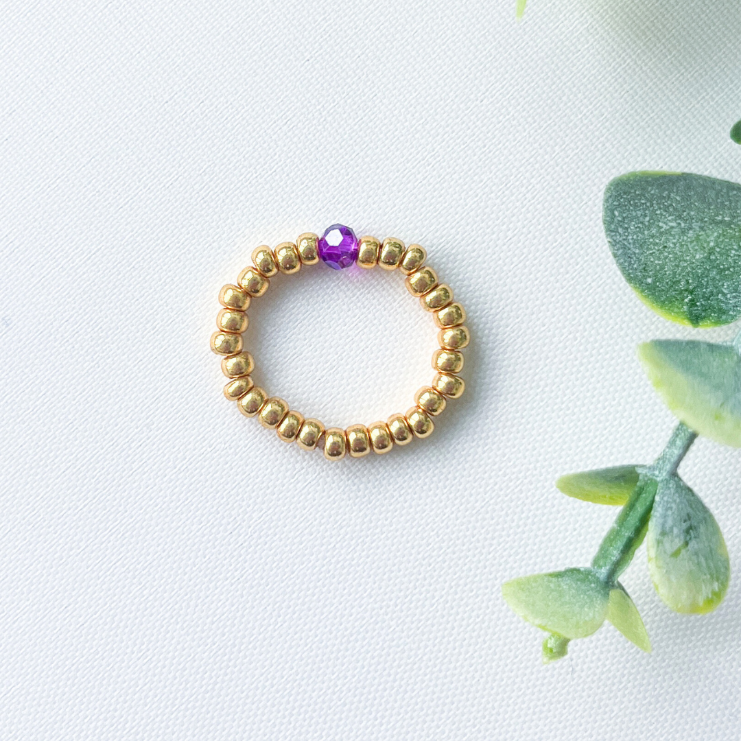 Damesring  - goud met paars