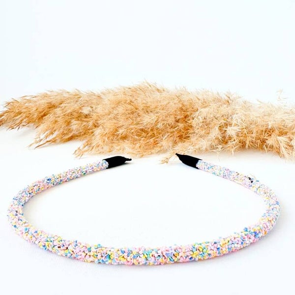 Haarband met all-over glitters - blauw geel roze