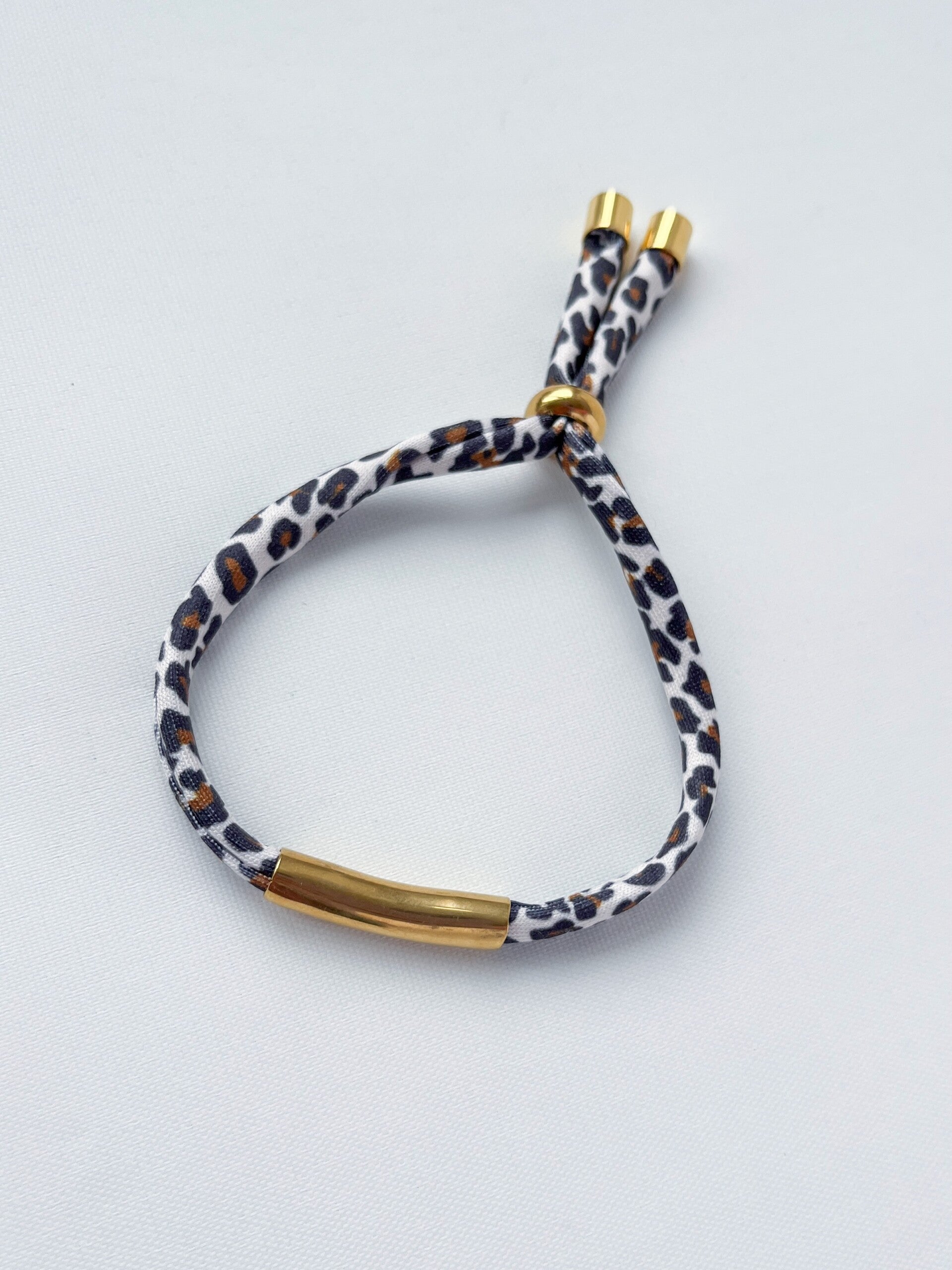 Damesarmband Ibiza elastiek - panter en goud