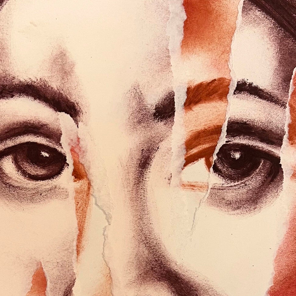 disegno di volto di donna strappato 