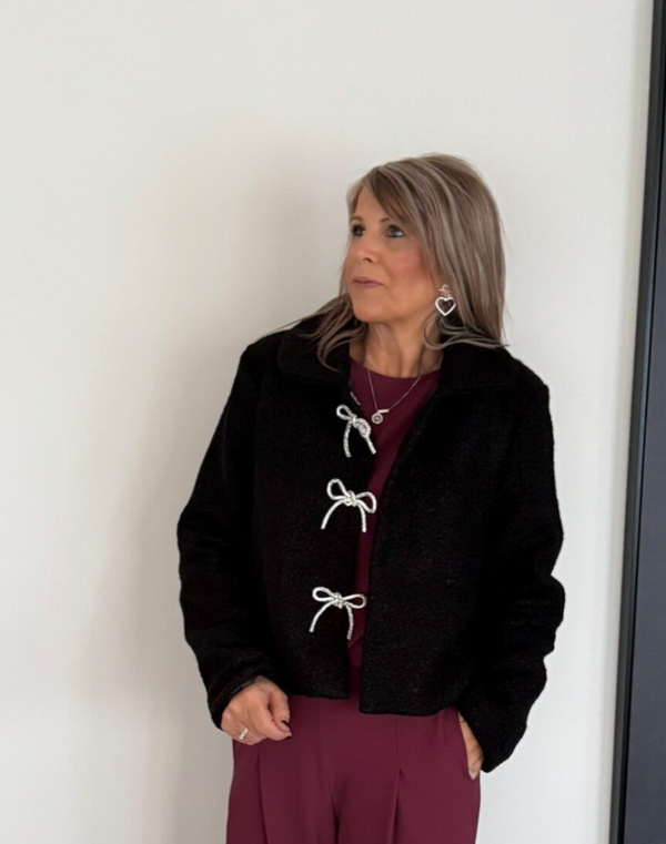 Bouclé vest met strikjes