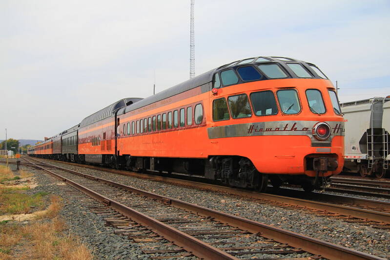 One of the Milwaukee Road's Skytop Lounge cars brings up the rear of a steam excursion behind Milwaukee Road 261.