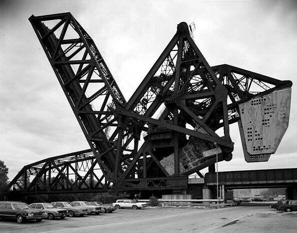 Looking southwest, the B&OCT bascule bridge over the Chicago River is in the foreground, locked in an upright position.