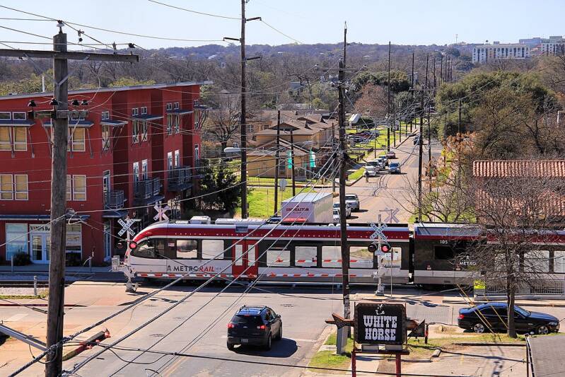 MetroRail train crossing Comal Street.