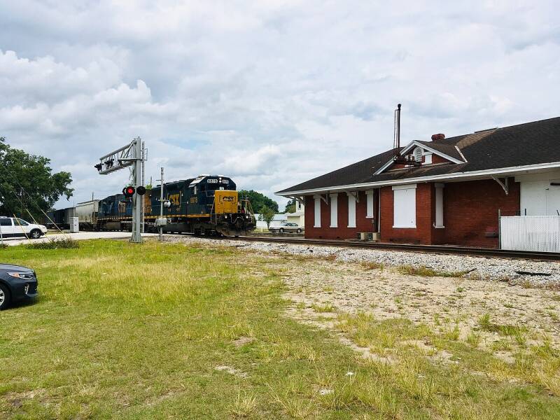 CSX train passing the historic Fort Meade Depot on the former Charlotte Harbor Division.